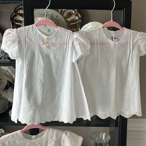 Vintage infant dresses used for baby shower decorations sold
